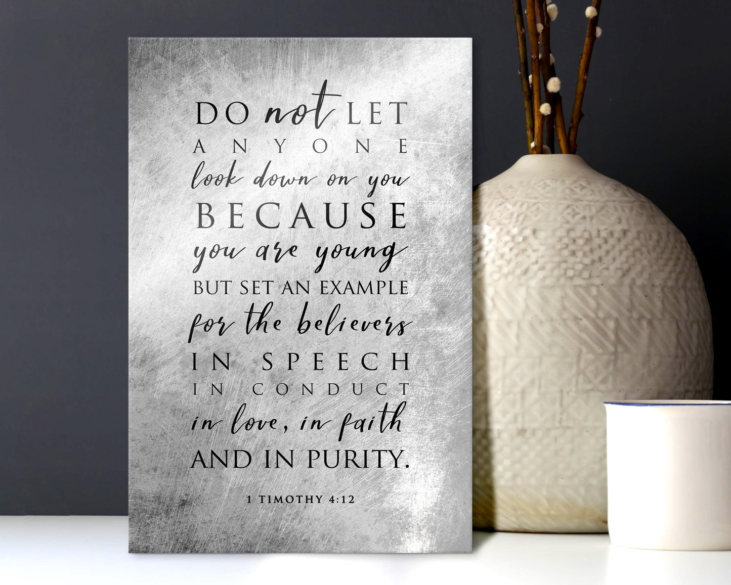 Metal distressed Christian wall decor featuring 1 Timothy 4:12 typography, in a silver and gray blended tone with black lettering.

Photo courtesy of Honeycomb Proverbs