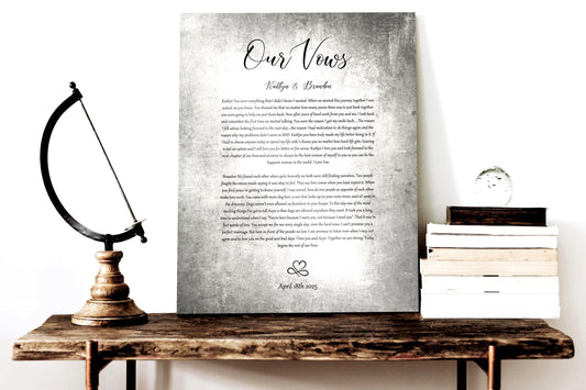 A wedding vow plaque on tarnished tin-alloyed aluminum, the traditional 10 year wedding anniversary metal, sits atop a shelf beside a stack of books.
The vows. names and union date sit on the center of the plaque with a heart/infinity symbol motif at the bottom. The inscription is done with a unique pairing of font styles for an eclectic style.

Photo courtesy of Honeycomb Proverbs